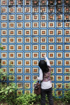 Rania Inspects a Decorative Statement Wall