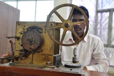 Sanjeev Gupta/European Pressphoto Agency. An employee of the National Telecom Museum in Bhopal, Madhya Pradesh, sitting behind an 1871 model of a telegraphic code machine invented by French engineer Emile Baudot.