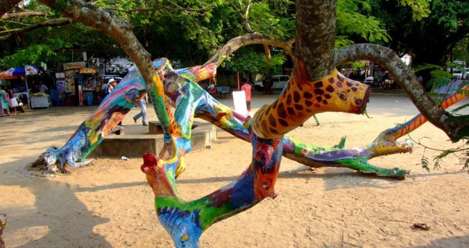 paintings on tree trunks