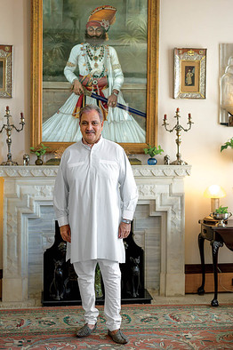 Photography by Robert Polidori. FAMILY AFFAIR | Gaj Singh II, known to some of his staff as the 'Jazz Age maharaja' for his love of jazz, in front of a portrait of his ancestor, Takhat Singh
