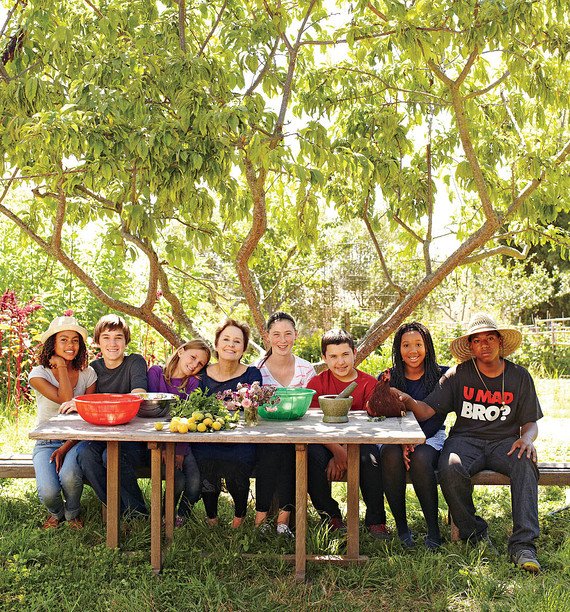 With students, under an elephant heart plum tree at the Edible Schoolyard Photography by William Abranowicz