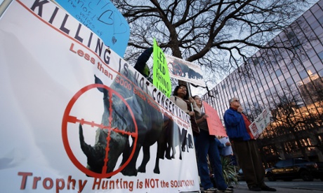 A protest outside the Dallas Convention Centre against the auction of a black rhino hunting permit. Photograph: Tony Gutierrez/AP