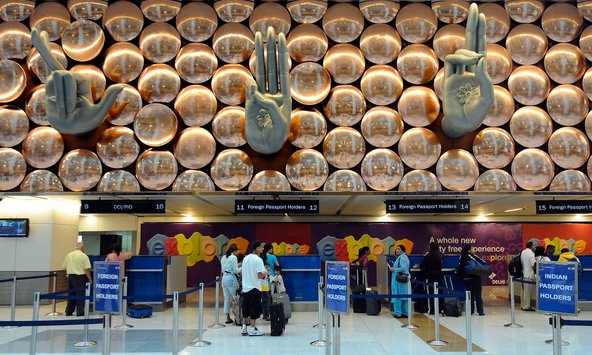Prakash Singh/Agence France-Presse — Getty Images. Travelers waiting at immigration counters at the Indira Gandhi International Airport in New Delhi on July 14, 2010.