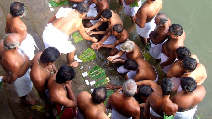 People wait to give offerings which will propitiate their ancestors