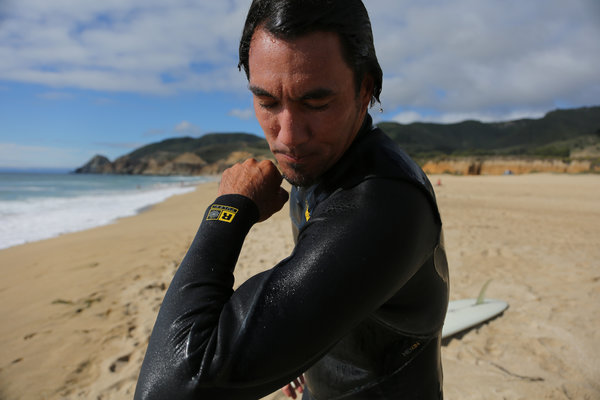 Jon Kitamura in a Patagonia wet suit at Montara State Beach, California. Credit Jim Wilson/The New York Times