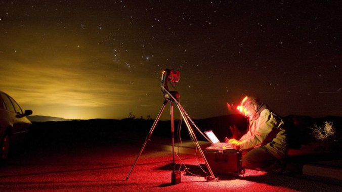 Dan Duriscoe works at a special computer-controlled camera used to photograph the night sky at Dantes View in Death Valley National Park in California. John Locher/AP