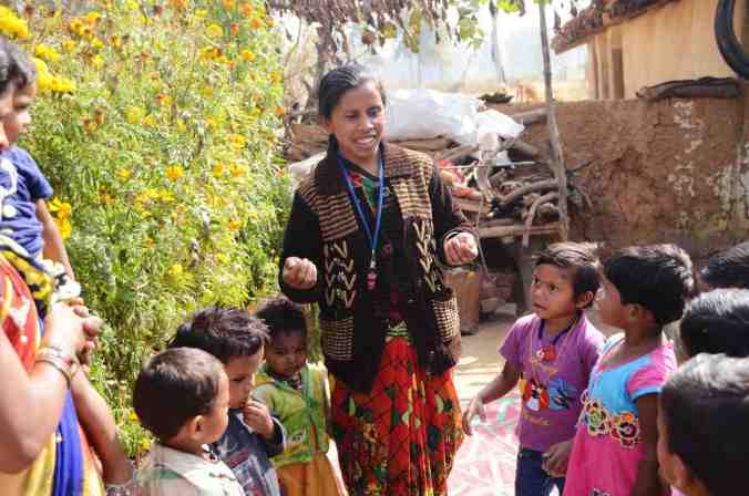 Nursery worker Shivkumari Pate leads children in a learning song. Pate works with the nonprofit Jan Swasthya Sahyog, which developed the first network of community nurseries. Ankita Rao for NPR