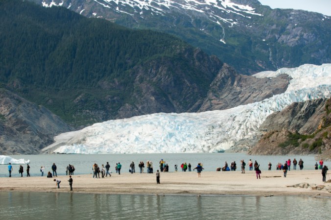 Tourists visit the the Mendenhall Glacier, in Alaska. Geologists are considering whether humans’ impact on the planet has been significant enough to merit the naming of a new epoch. CREDIT PHOTOGRAPH BY MATTHEW RYAN WILLIAMS/THE NEW YORK TIMES/REDUX