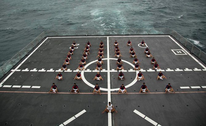 India celebrates its first International Yoga Day today. PHOTO: Members of the Navy performing Yoga at sea.