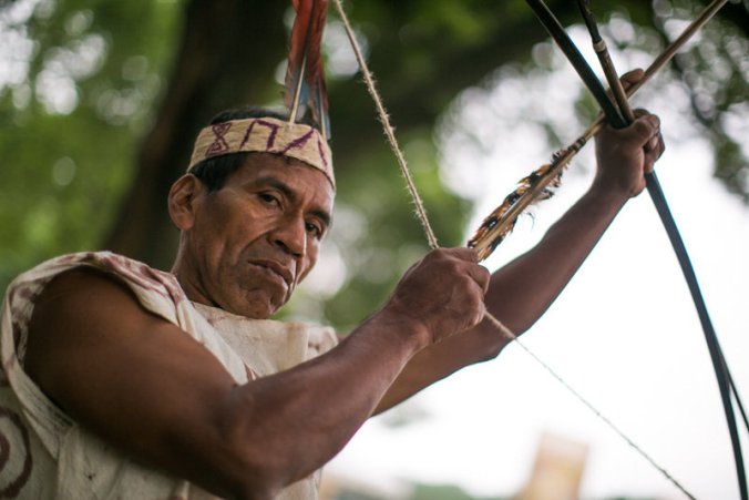 Victorio Dariquebe Gerewa displays his bow and arrow at the Smithsonian Folklife Festival in Washington, D.C. PHOTO:  Ben de la Cruz/NPR
