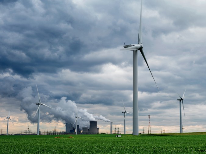 Wind turbines surround a coal-fired power plant near Garzweiler in western Germany. Renewables now generate 27 percent of the country’s electricity, up from 9 percent a decade ago. PHOTO: Nat Geo