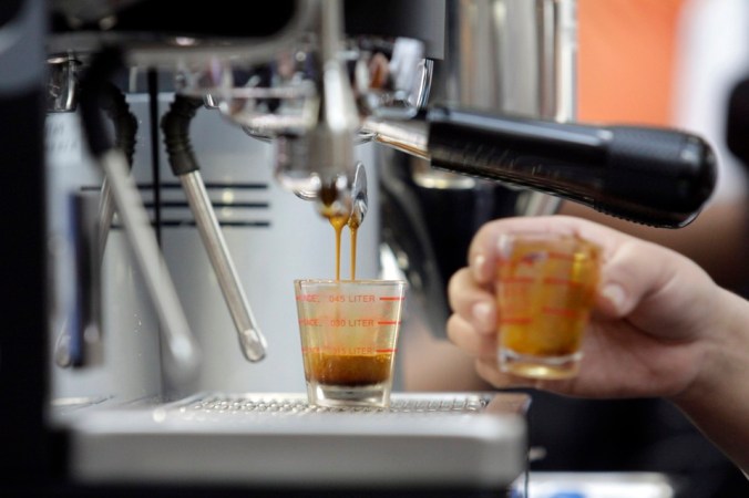 A competitor prepares coffee during the El Salvador National Barista Championship at a mall in San Salvador